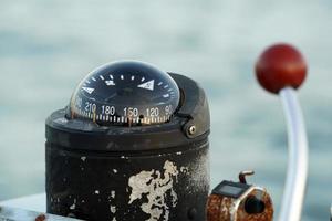 boat control engine speed knob lever and compass photo
