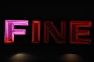 fine neon sign on black photo