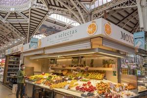 VALENCIA, SPAIN - MAY 3 2022 - The historic market full of customers photo