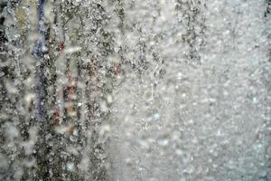 people inside rockfeller center fountain splash in new york manhattan photo