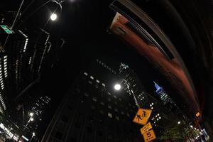 new york city night skyscraper cityscape from street photo