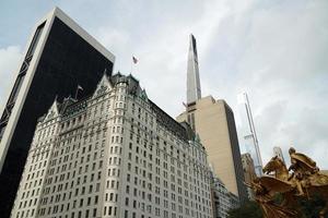 new york city skycrapers from street 5th avenue central park entrance photo