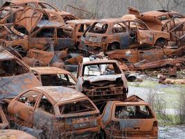 junkyard old rusted car field photo