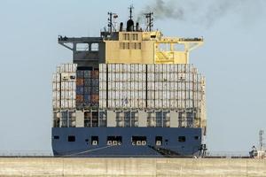 Container ship while docking in genoa harbor photo