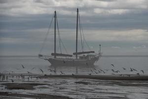 Ship in the fog background photo