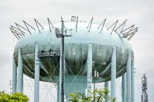 Water tower in the deep blue sky photo