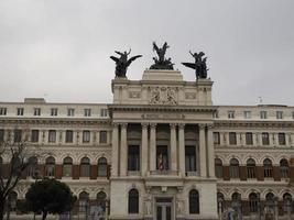 Sculptures on a top of Formento Palace Ministry of Agriculture in Madrid photo