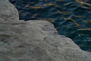 celebrity celebrities names graffiti on saint peter pools Malta rock formation photo