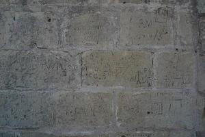 Medina medieval village stone graffiti on building in Malta photo