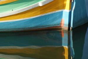 malta colorful painted fishing boat in marsaxlokk village photo