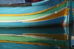 malta colorful painted fishing boat in marsaxlokk village photo