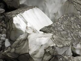 The view of workers cover Marmolada glacier during summer time preventing ice melting, Trentino-Alto Adige, Italy. photo
