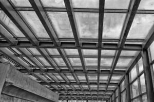 metallic building framework in black and white photo