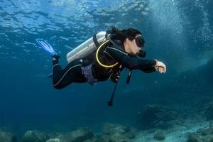 beautiful latina mexican girl diving in cortez sea photo