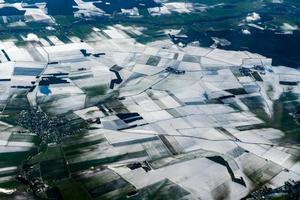 farmed fields covered by snow aerial panorama photo