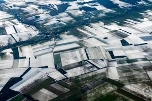farmed fields covered by snow aerial panorama photo