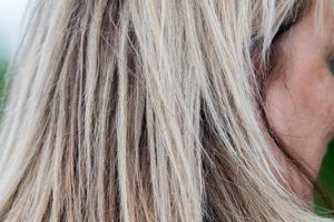 adult woman blonde hairs detail photo