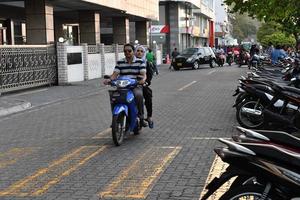 MALE, MALDIVES - FEBRUARY 17 2018 - Heavy traffic in the street before evening pray time photo