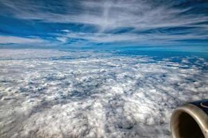 clouds in the sky from airplane window photo