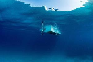 boat ship from underwater blue ocean photo