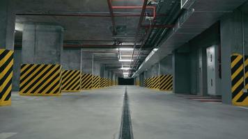 Large underground parking without cars. Parking in a building or shopping center where there are no cars. video