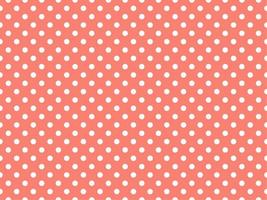 white polka dots over salmon background vector