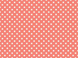 white polka dots over salmon background vector