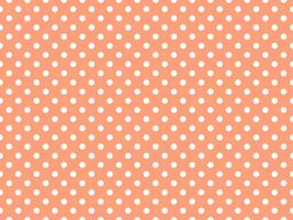 white polka dots over light salmon background vector