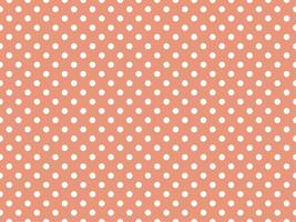white polka dots over dark salmon background vector