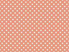 white polka dots over dark salmon background vector