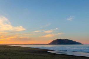 Beautiful sunny sunrise on the beach photo