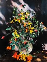 Bouquet with rosehip, rudbeckia, nasturtium photo