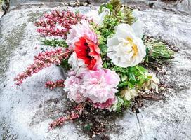 Bright romantic bouquet of spring flowers in the garden photo