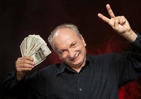 old man with dollar bills photo