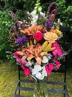 Bright festive bouquet in the garden in a glass vase photo