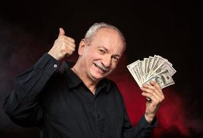 old man with dollar bills photo