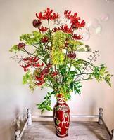 Romantic bouquet on a coffee table with soap bubbles photo