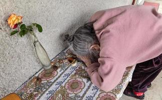 Old woman. Elderly depressed woman photo