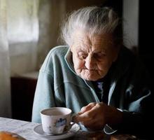 Elderly lonely woman photo