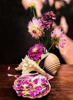 Romantic bouquet with dahlias and sea shells photo
