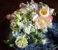 Romantic bouquet on a decorative plate photo