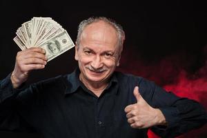 old man with dollar bills photo