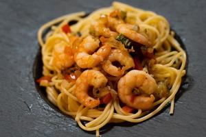 Spaghetti alla busara pasta with shrimps an Italien specialty photo