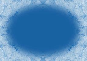 Christmas background in trendy color 2020 Classic Blue. Winter frosty window pane with copy space. photo