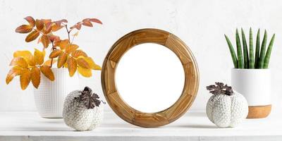 Halloween, fall, thanksgiving banner. Round frame, house plants, ceramic pumpkins, leaves on white. photo