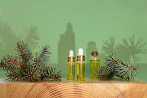 Aromatherapy and spa composition with essential spruce oil and branches and with trendy shadows.