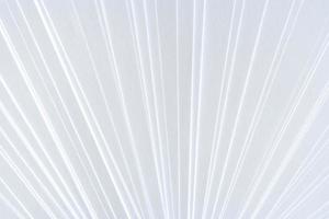 White symmetric geometric pattern of clean paper sheets, spaced as fan. photo