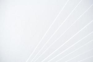 White minimalistic geometric paper background with a light-shadow pattern and with copy space. photo