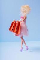 Valentines day sale shopping concept. Dall with shopping bags photo