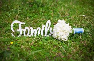 family wooden letters and beautiful wedding bouquet photo